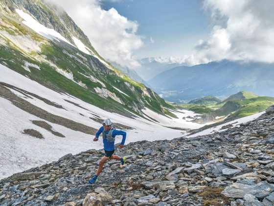 Patagonia trail runner running through valley