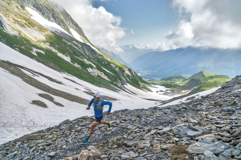 Patagonia trail runner running through valley