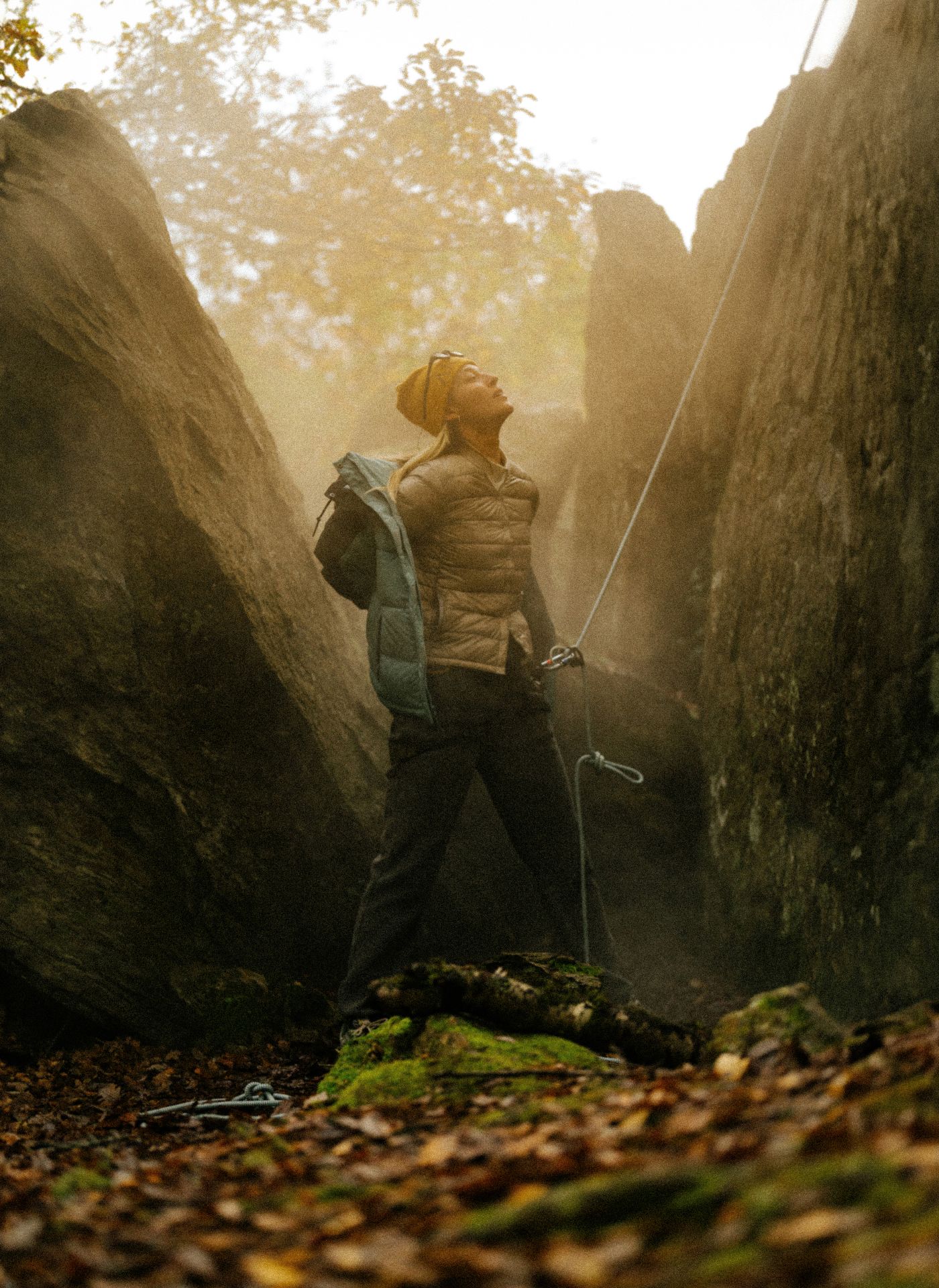 outsiders email case study. image of woman standing at base of crag