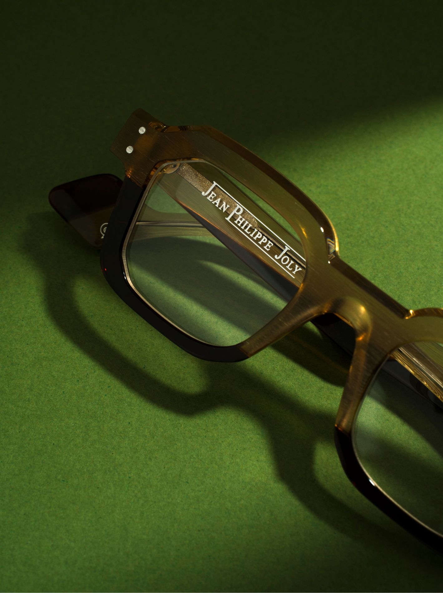 Product shoot for Seen Opticians with green background