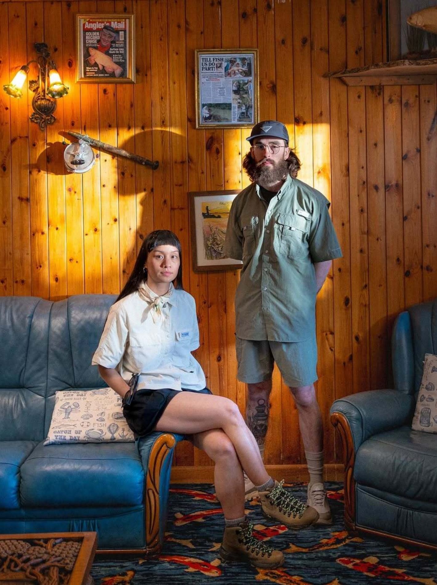 Two models in log cabin, wearing Columbia's PFG range