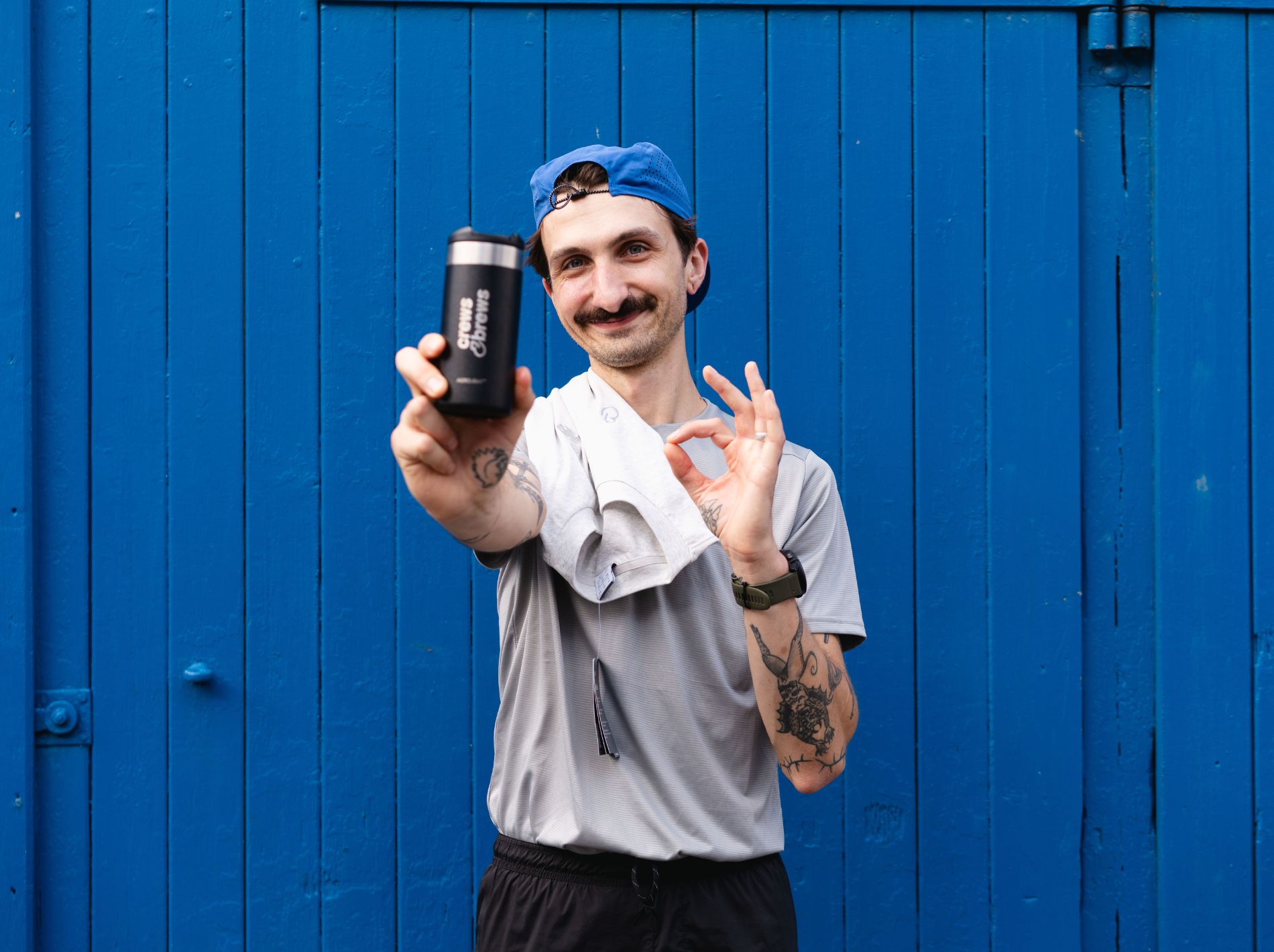 Community run club member holding up Stanley flask