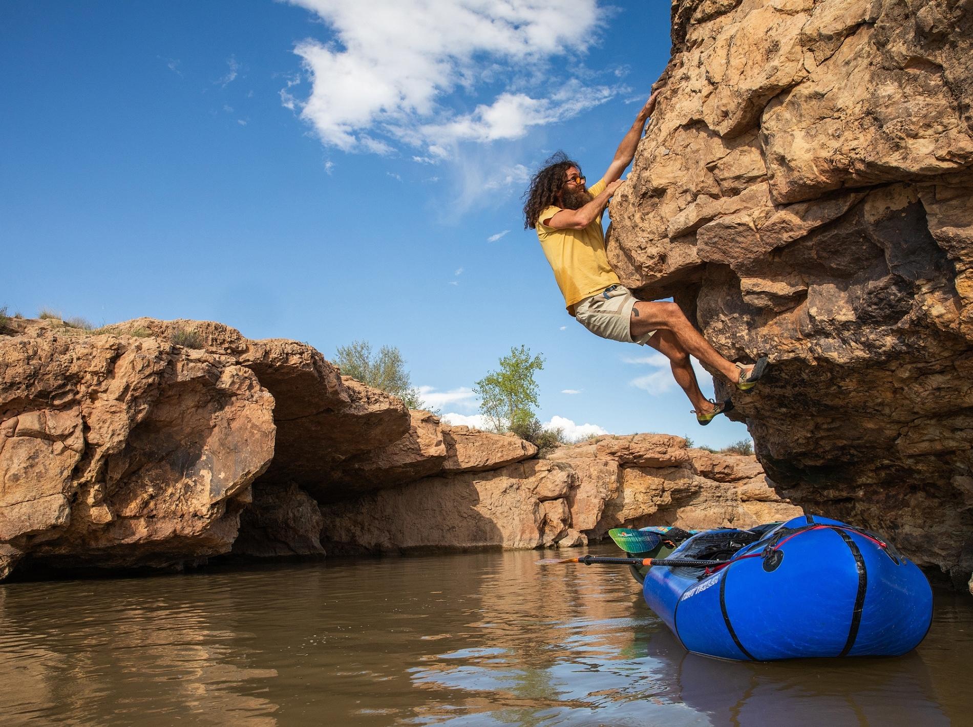 Patagonia campaign image of man bouldering over water