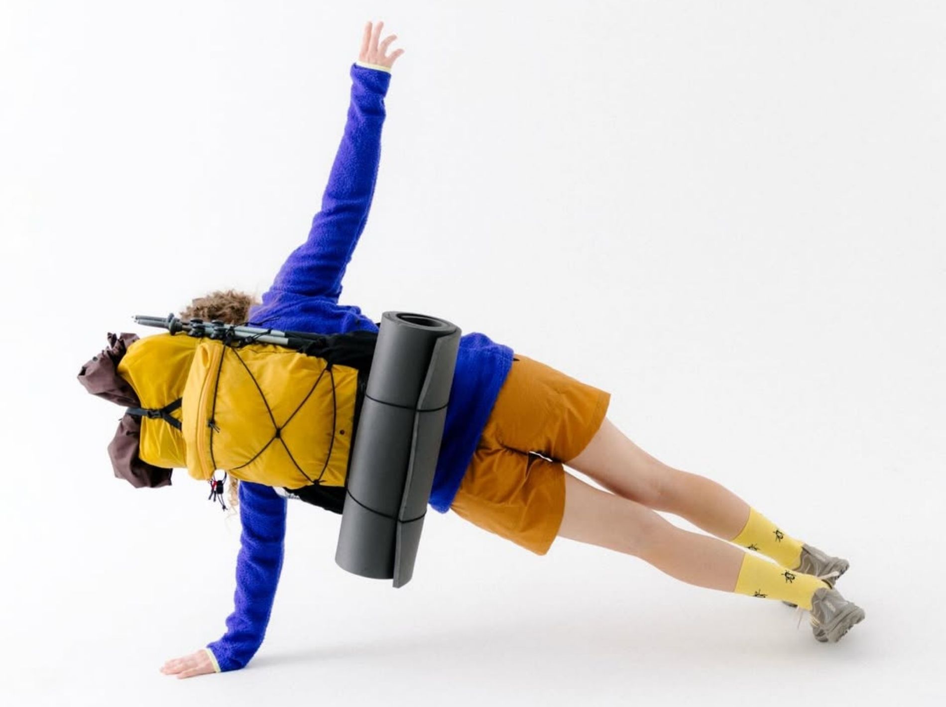 Studio shot of model doing a side plank wearing yamatomichi